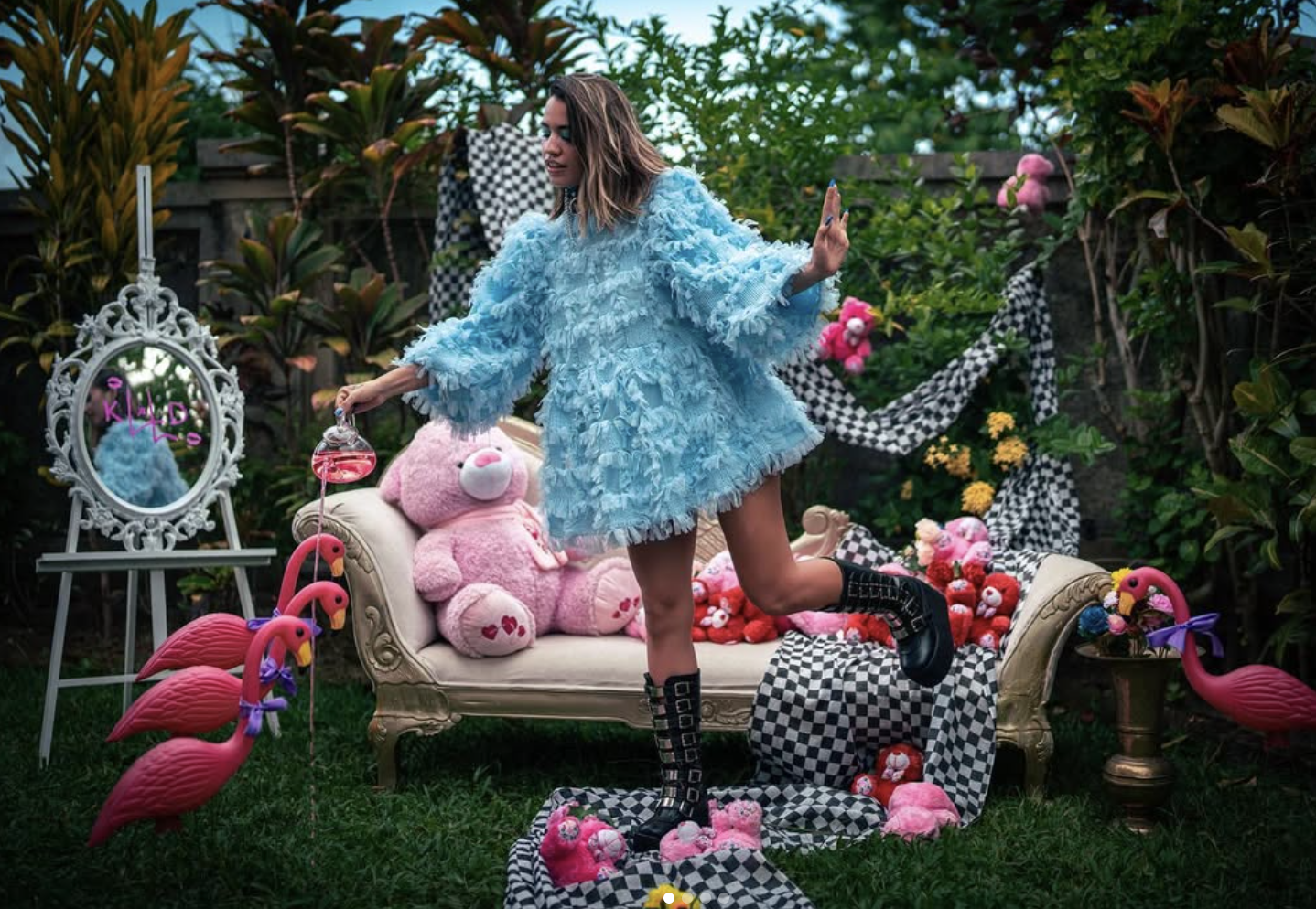 Katerina Francesca in her Bali garden, surrounded by Rainbow Bears and flamingos